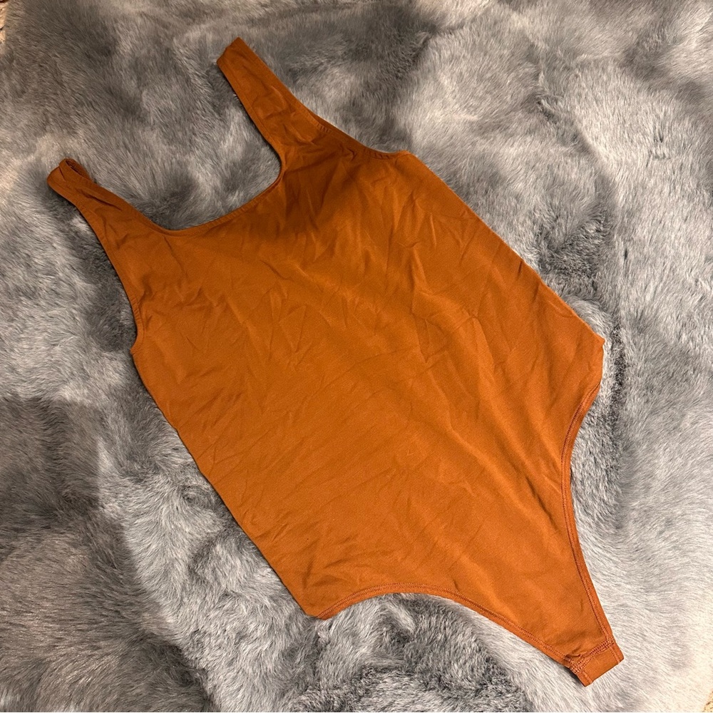 SKIMS Sculpting One-Piece Bodysuit in Burnt Orange